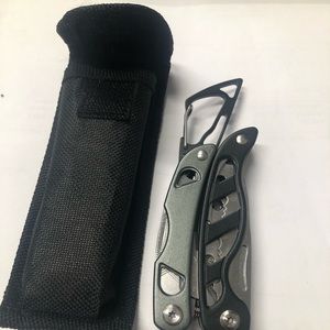 Pocket tool. Has pliers, file, saw blade etc